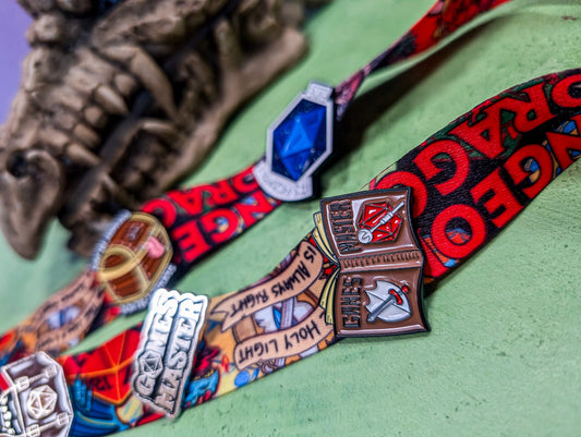 Games Master Book Pin